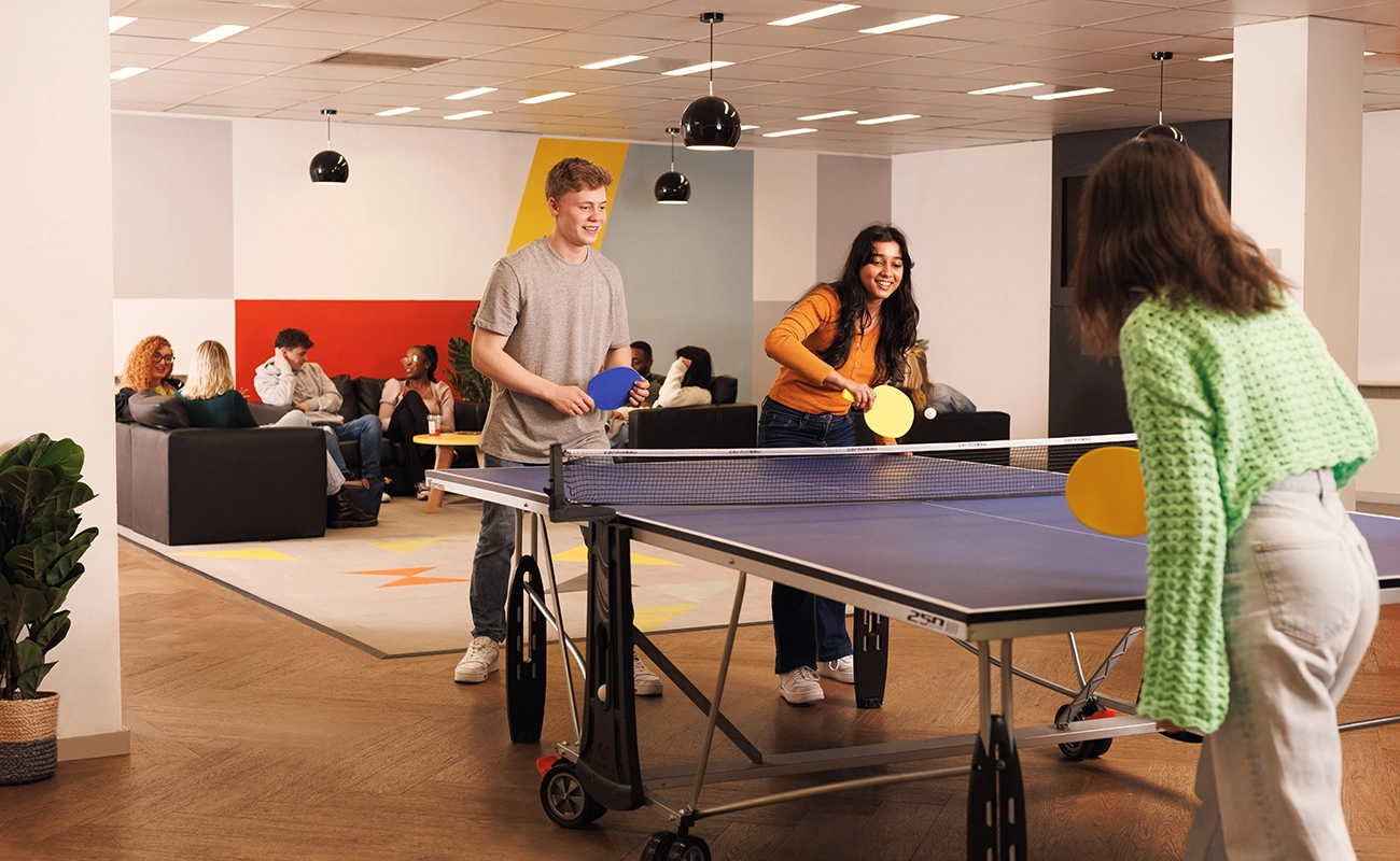 Students playing Ping Pong in the common room