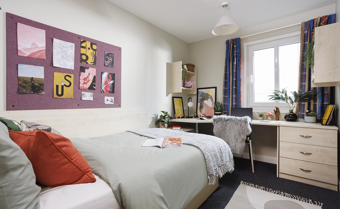 Bed and study space in an Ensuite Premium Range 1 room