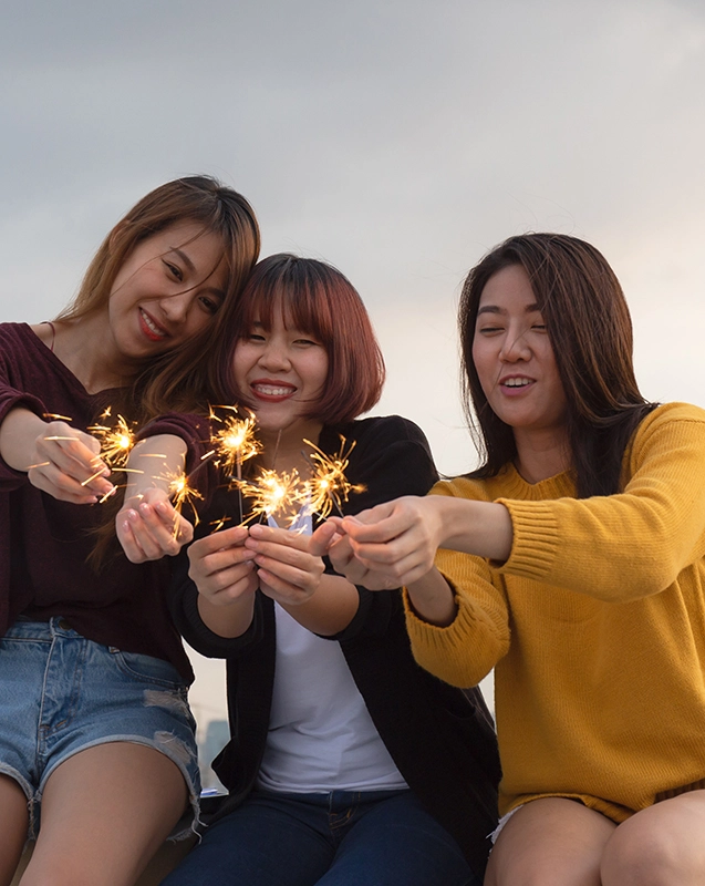 Students holding sparklers