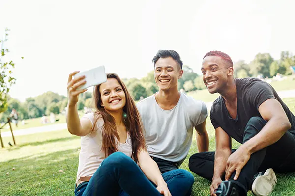 Students taking a groupie in a park