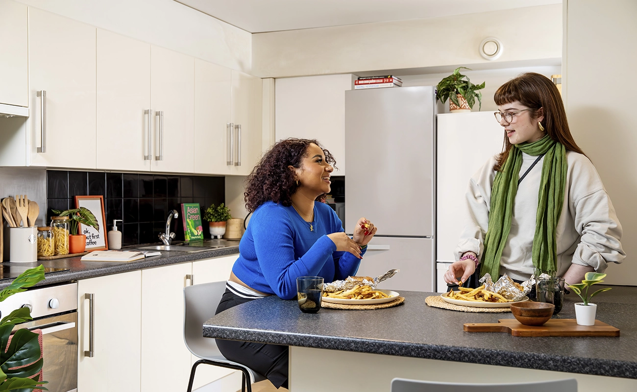 Students in the shared kitchen for ensuite rooms