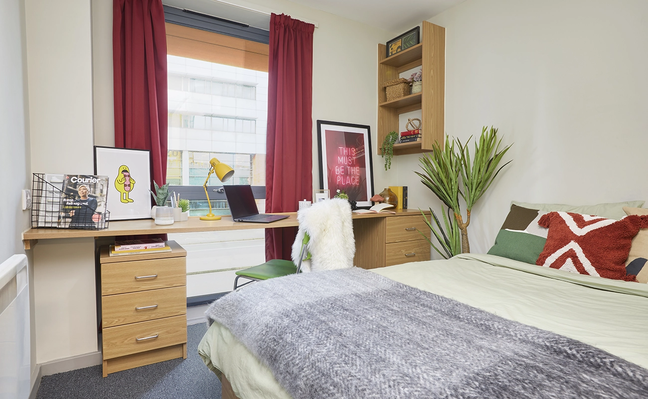 Bed and study space in an Ensuite Classic room