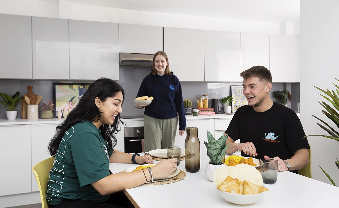 Students in the shared kitchen for ensuite rooms