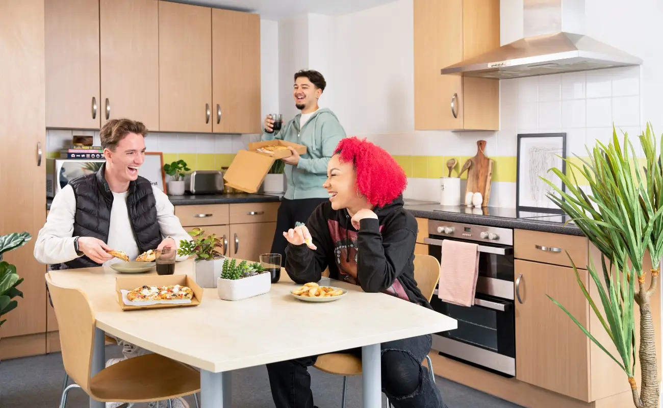 Students in a shared kitchen