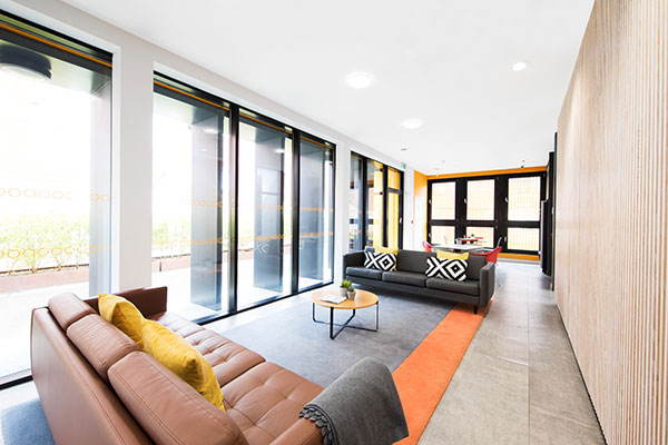 Common room with pool table and seating at Oak Brook Park in Birmingham