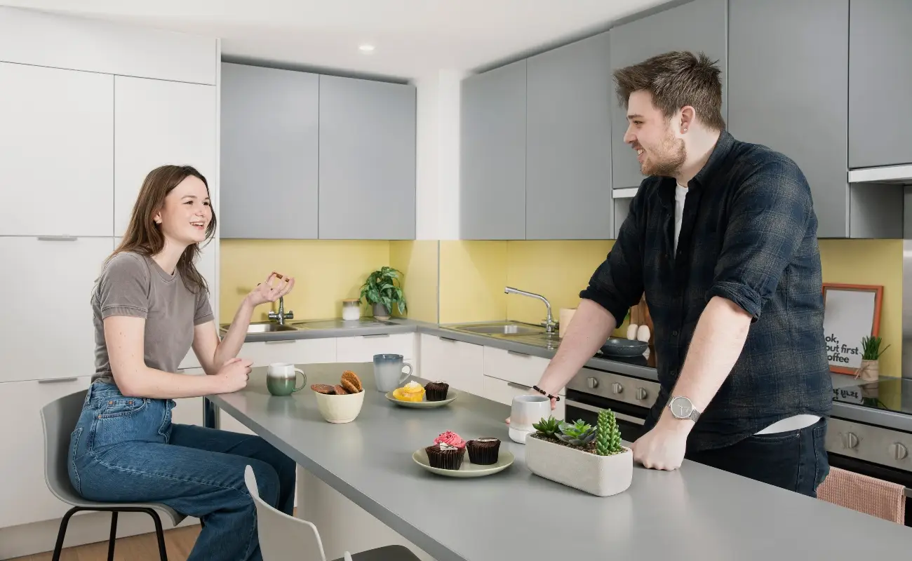 Students in a shared kitchen