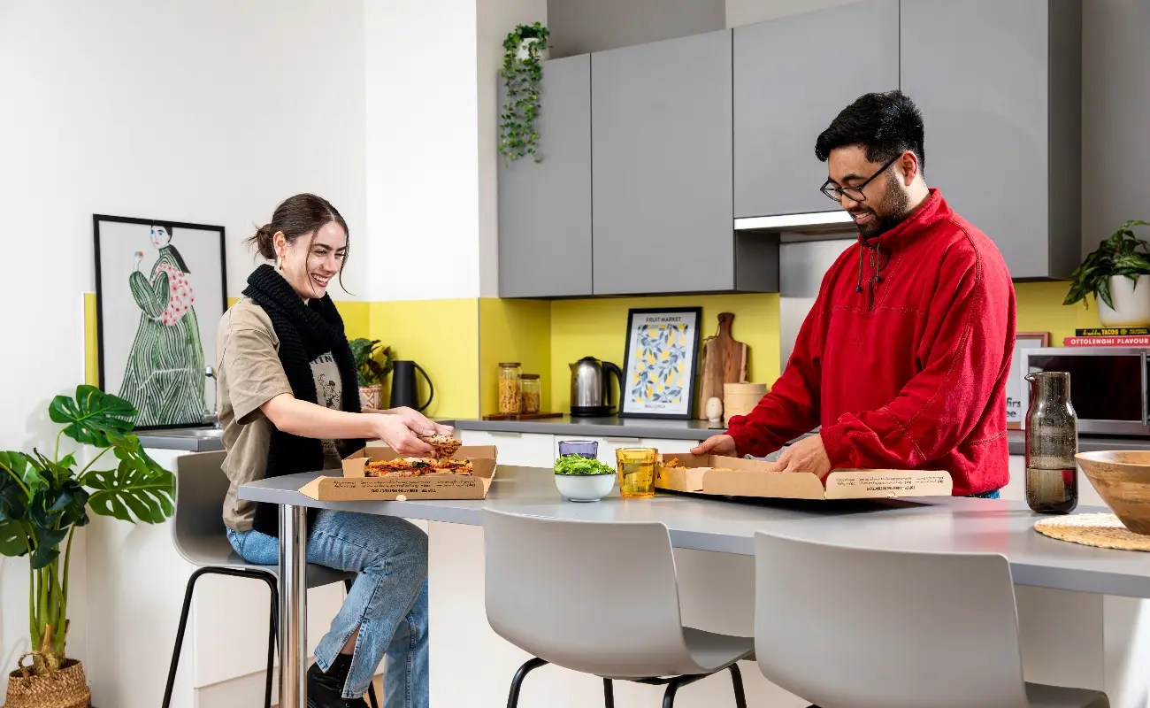 Students in a shared kitchen