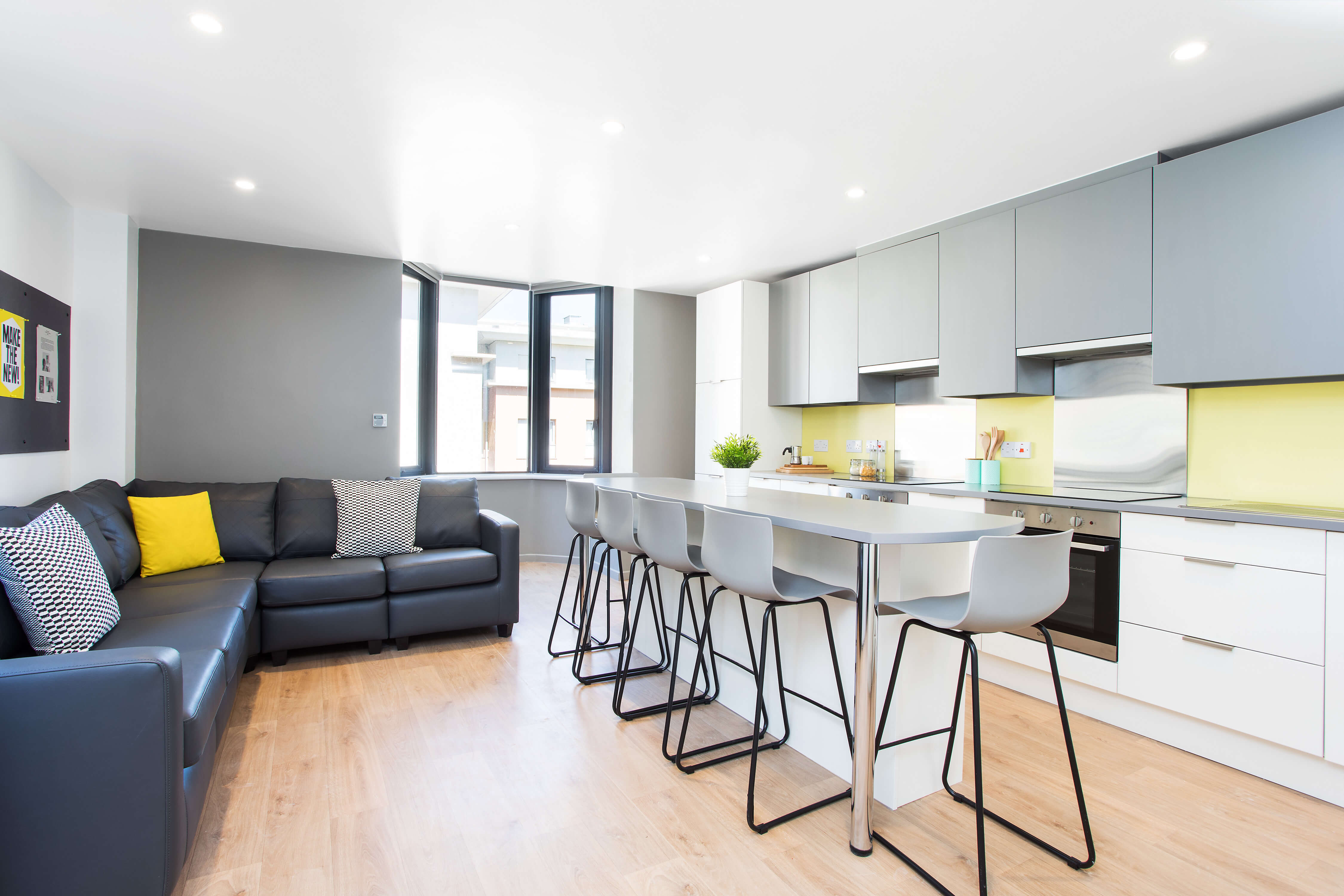 Kitchen with breakfast bar island and sofas