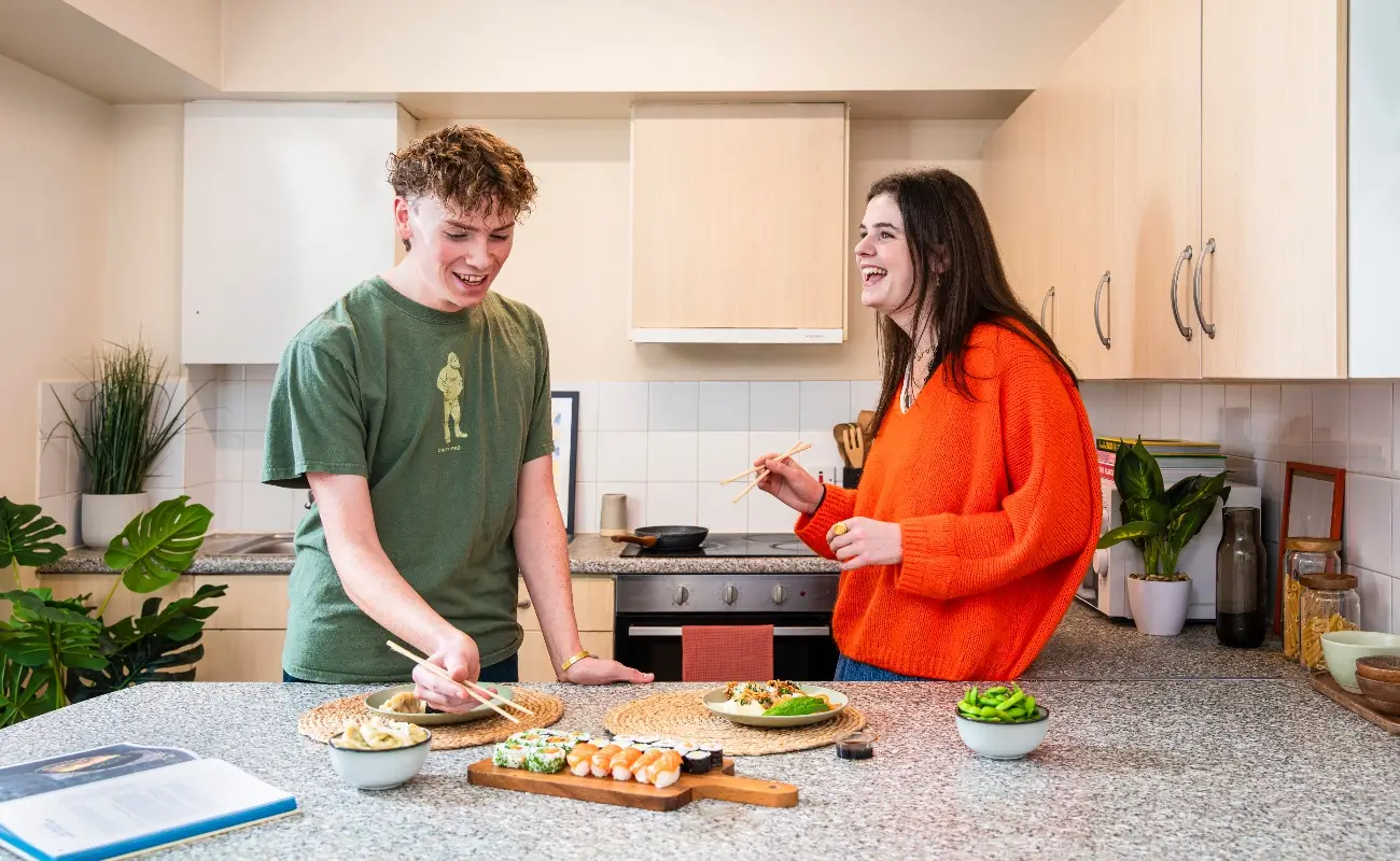 Students in a shared kitchen