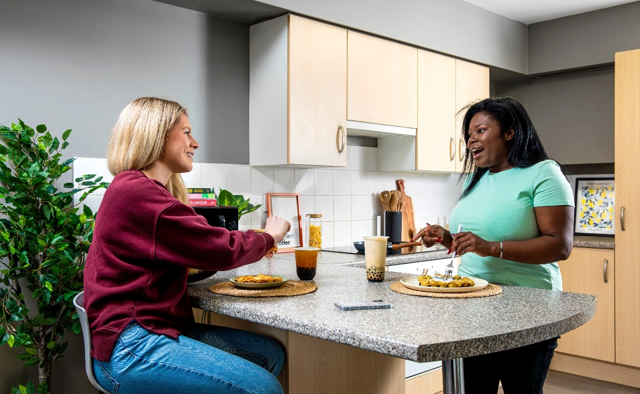 Students in a shared kitchen