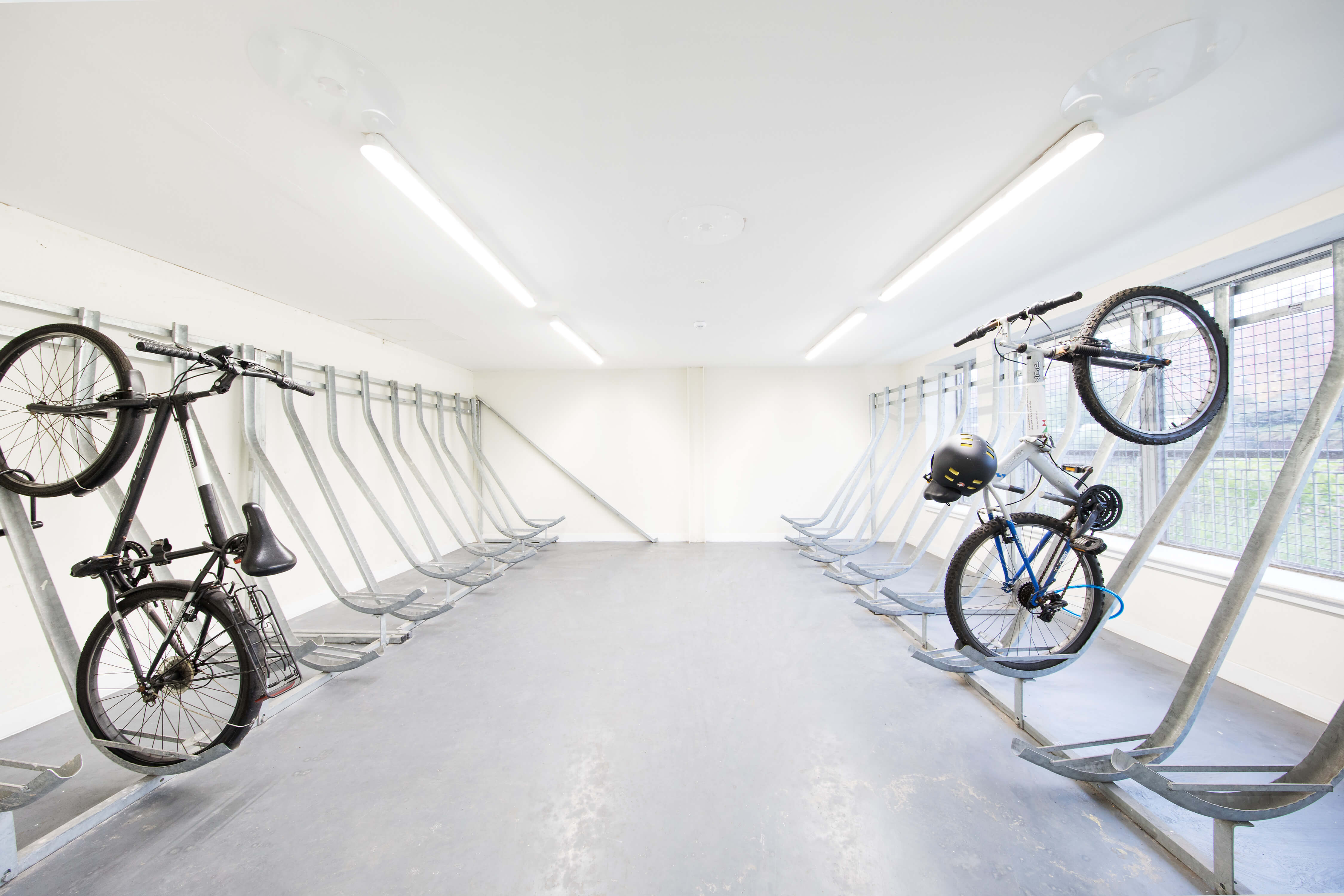 Bikes on racks in a storage room