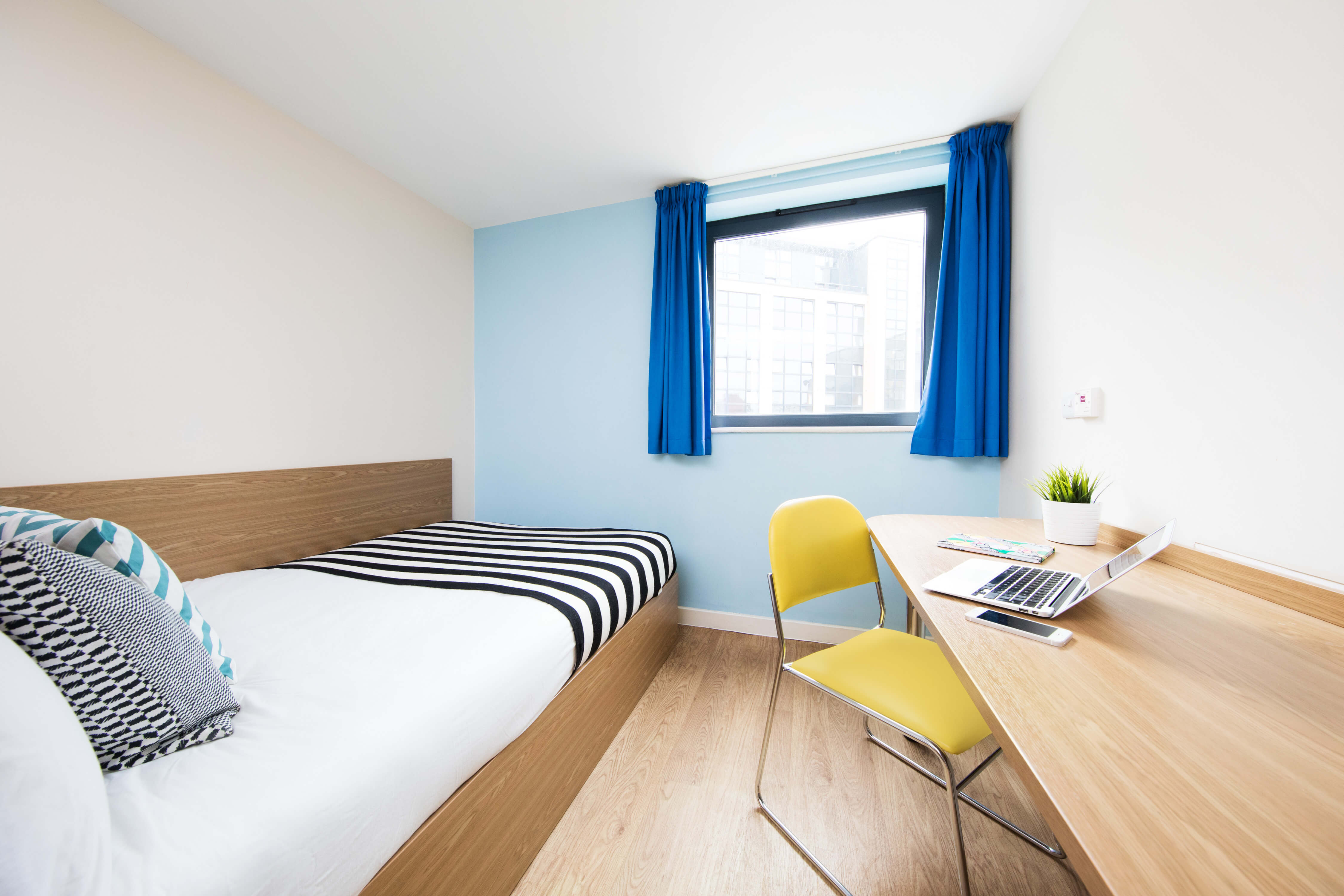 Bed and study space in a studio room