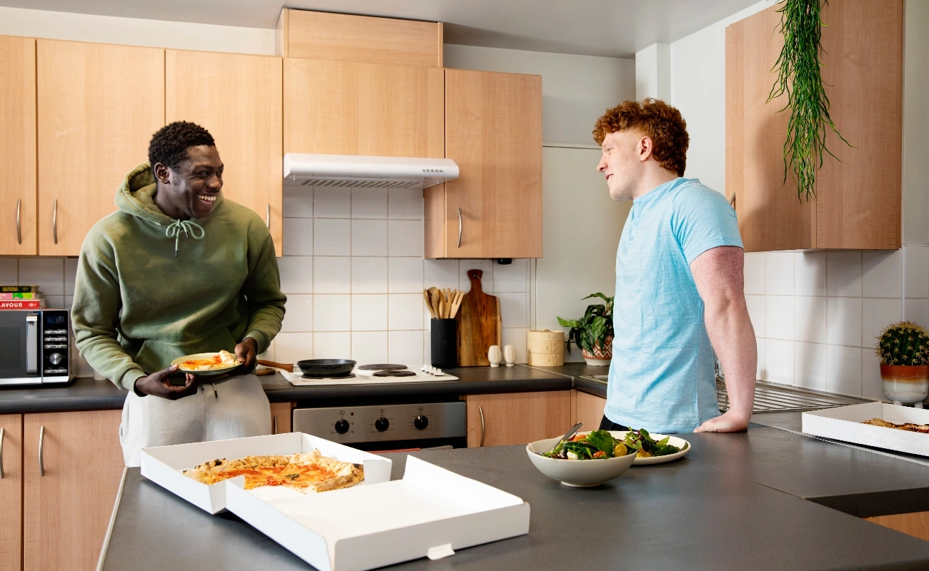 Students in a shared kitchen