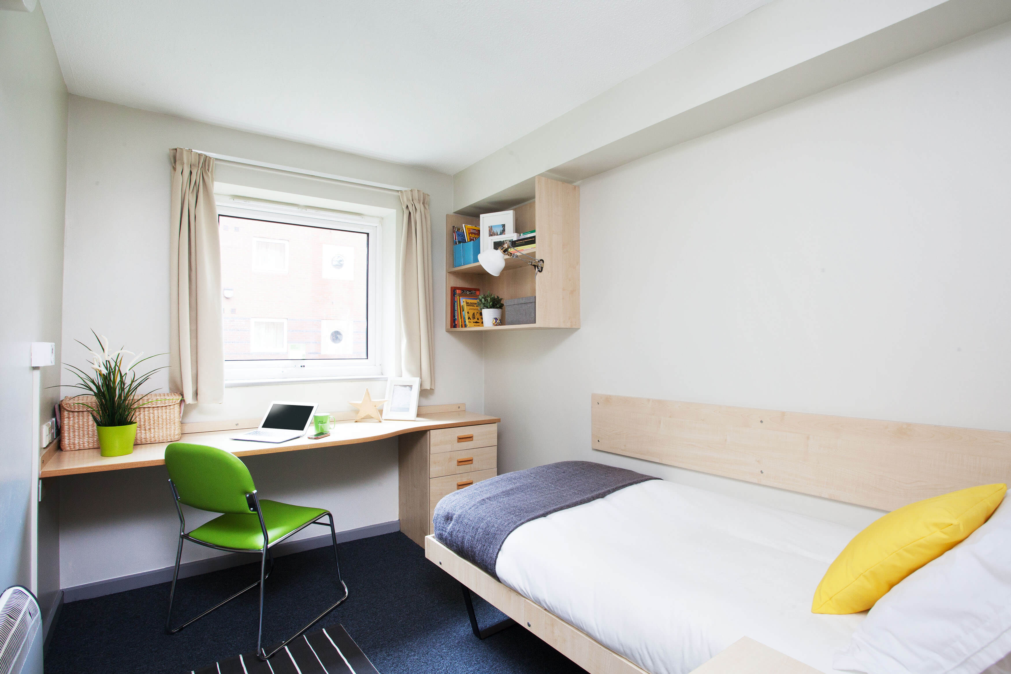 Bed, window and study space in a Classic En-suite room