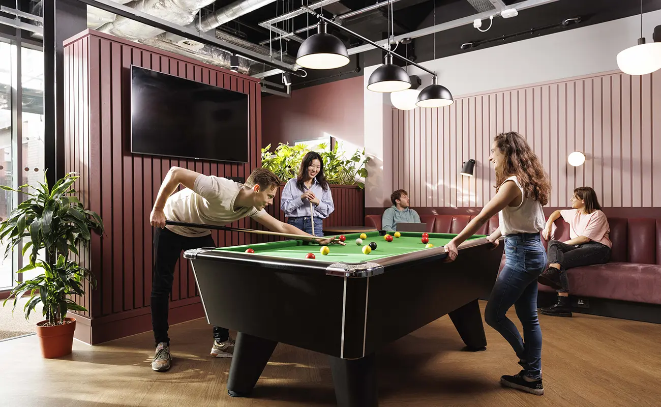 Students using the games area in the common room