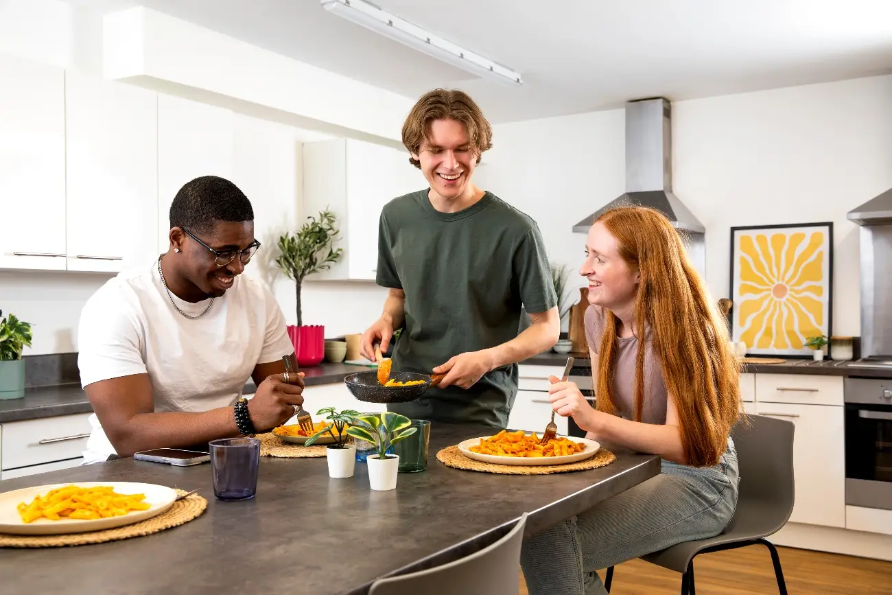 Students in a shared kitchen