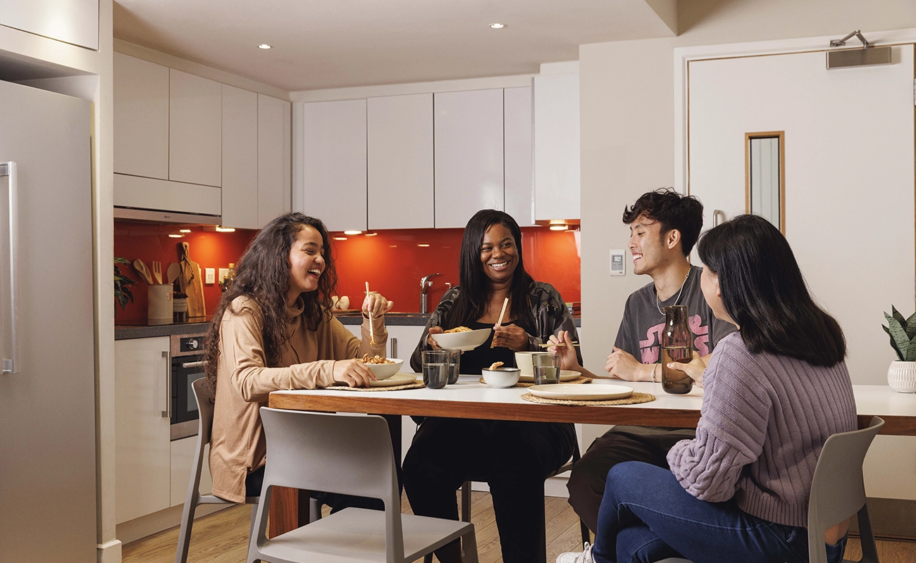 Students using a shared kitchen for ensuite rooms