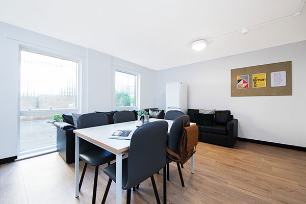 Dinning area and sofa seating in the shared kitchen for ensuite rooms