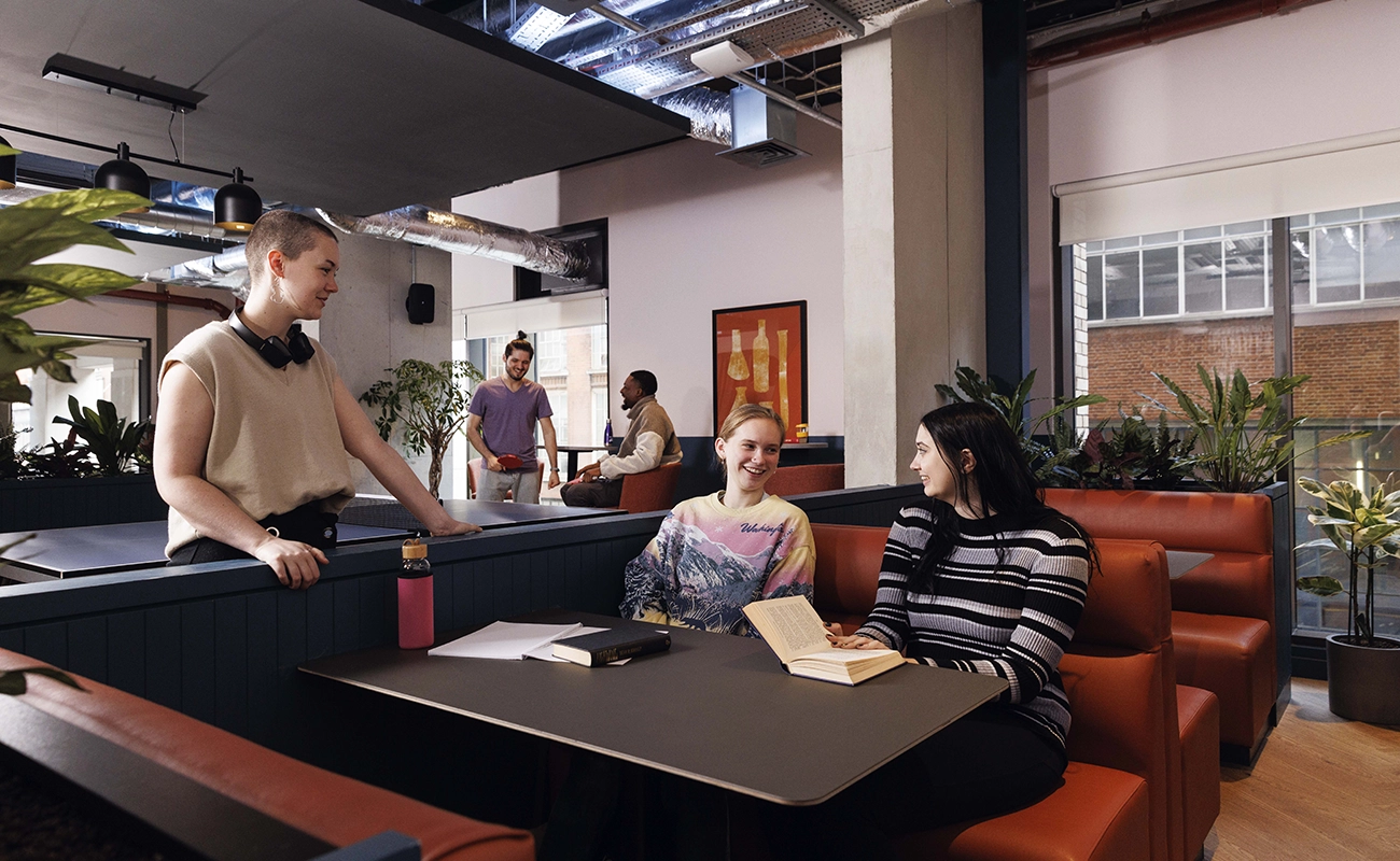 Students using the games area in the common room