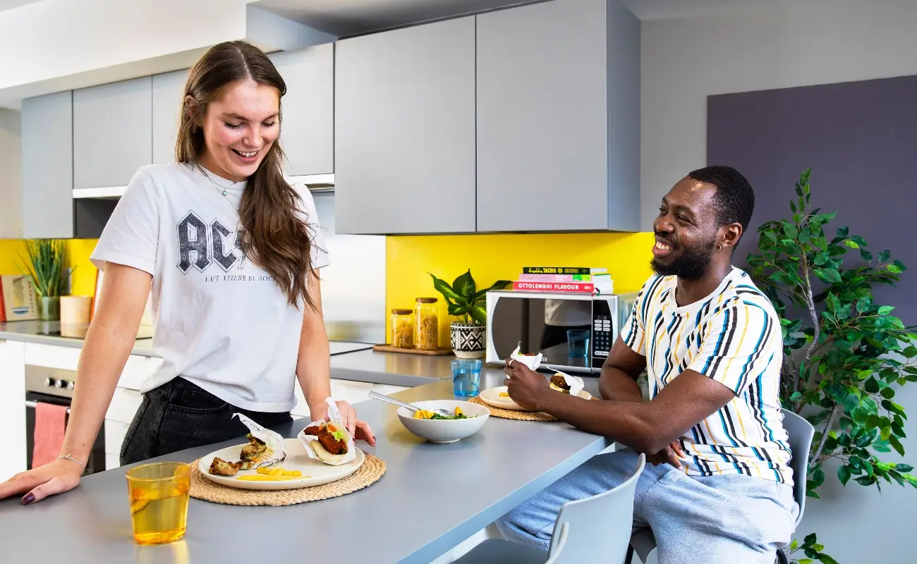 Students in a shared kitchen