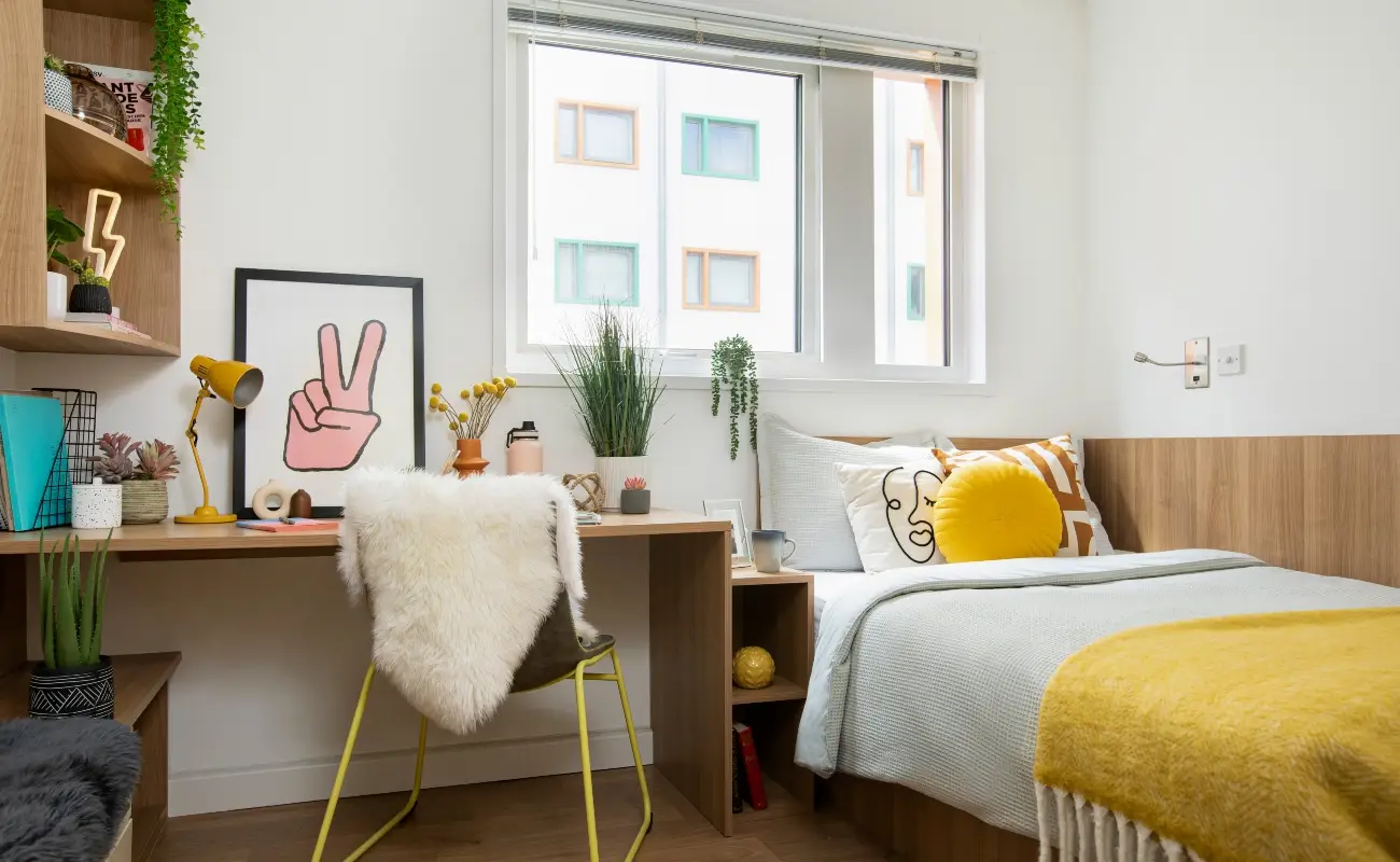 Bed and study space in an Accessible Ensuite Classic