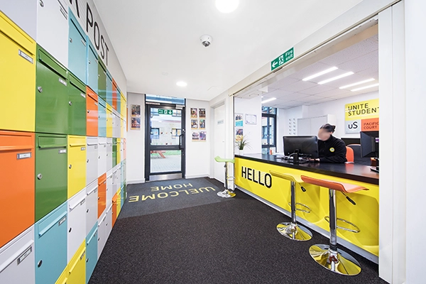 Student accommodation London reception desk and post boxes at Pacific Court