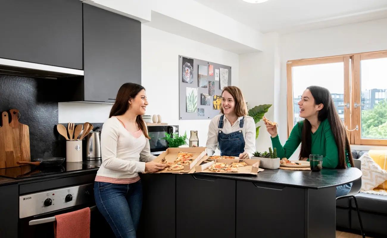 Students in a shared kitchen