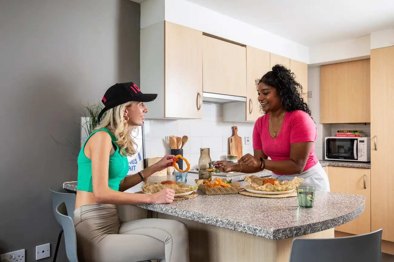 Students in a shared kitchen