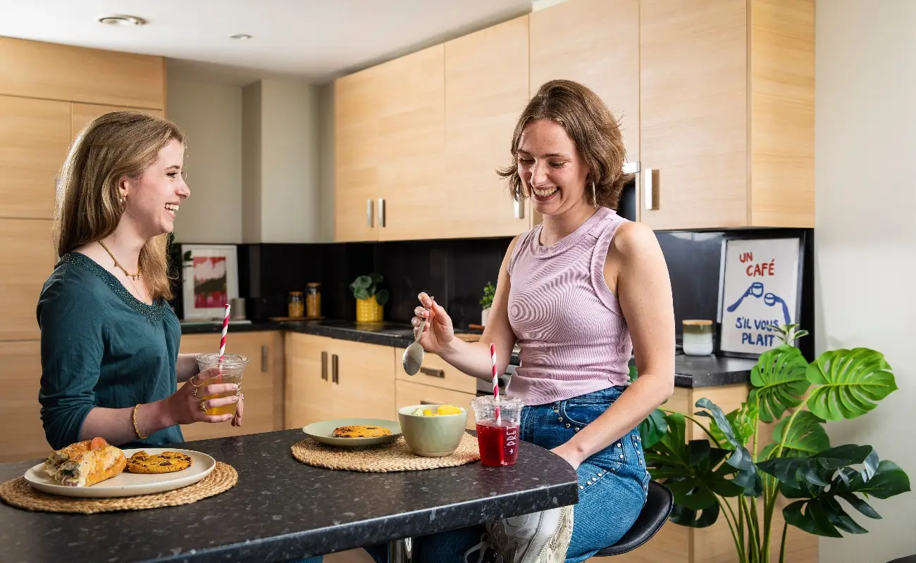 Students in a shared kitchen