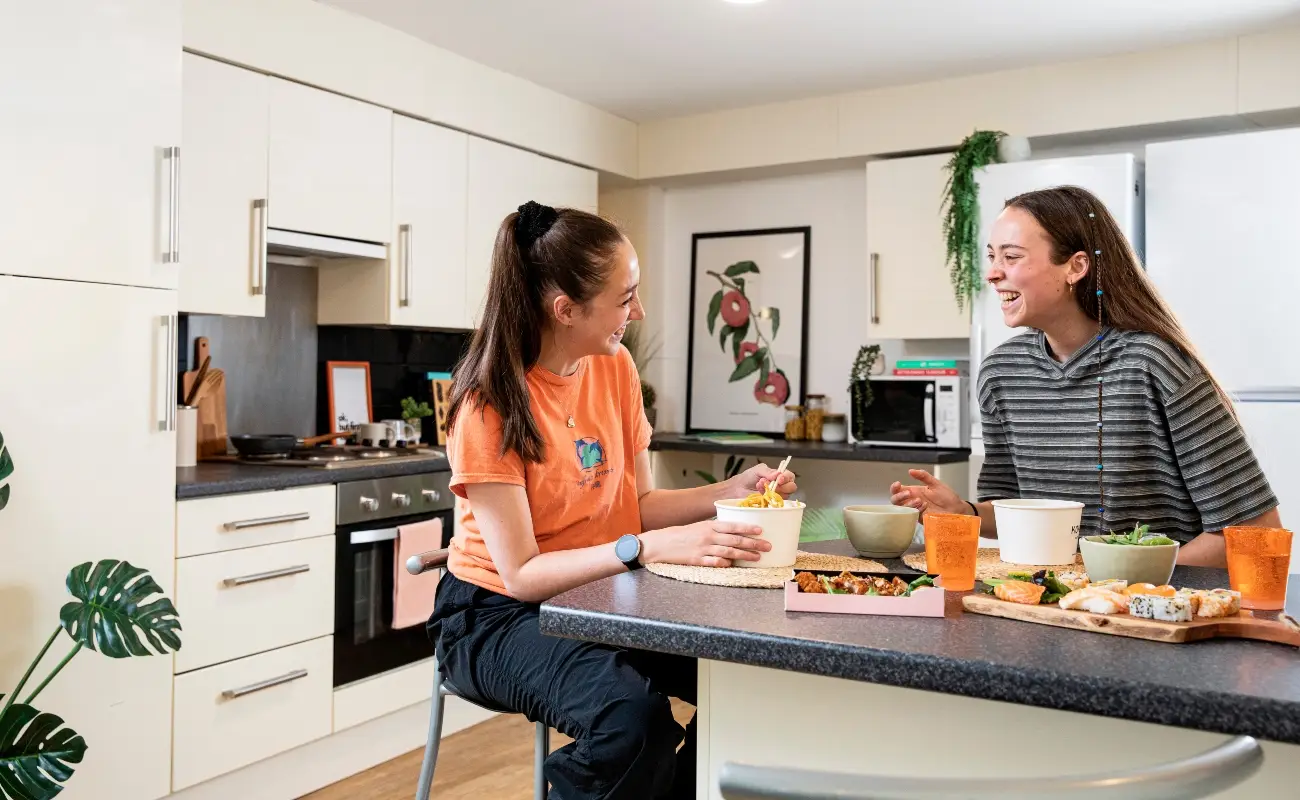 Students in a shared kitchen