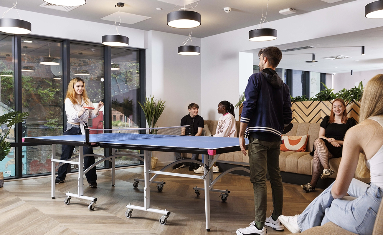 Students using the games area in the common room