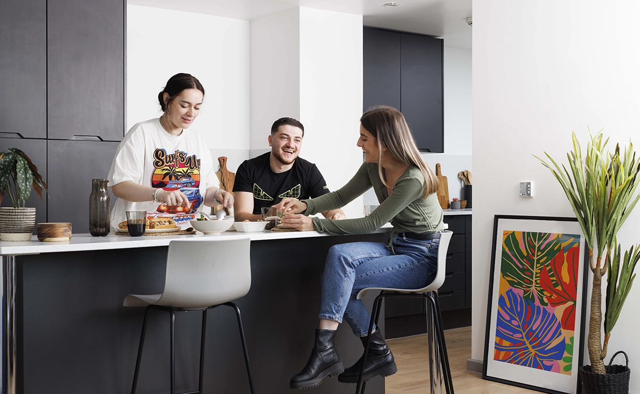 Students using the shared kitchen for ensuite rooms