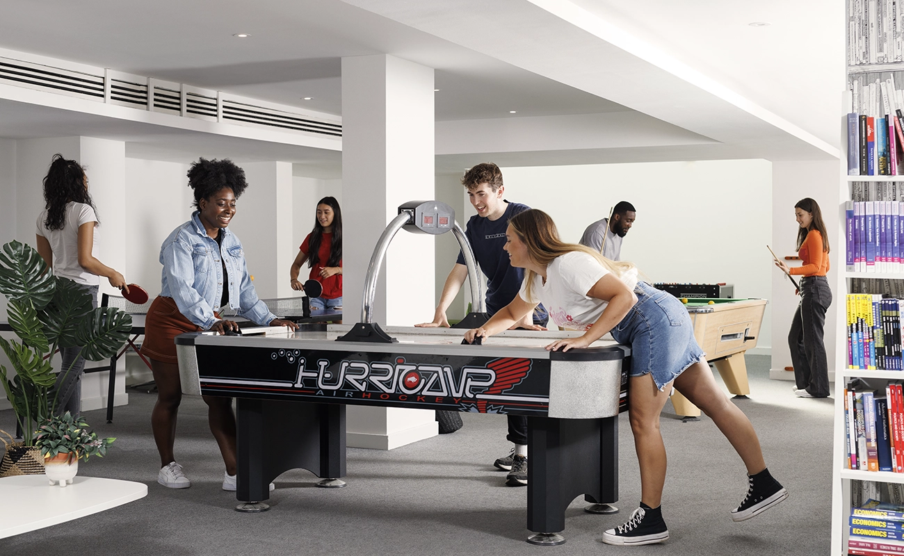 Students in the common room games area