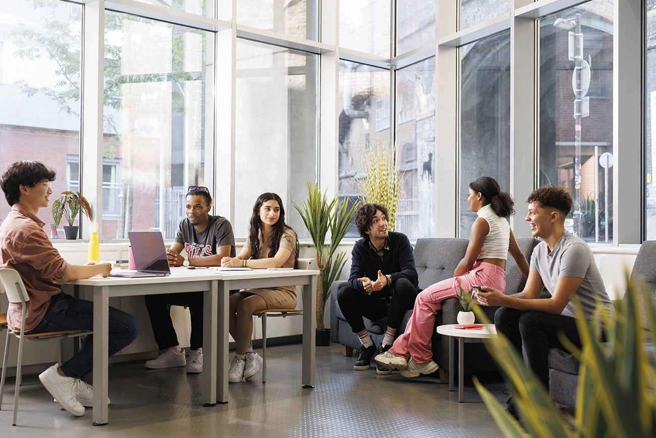 Students in the reception seating area