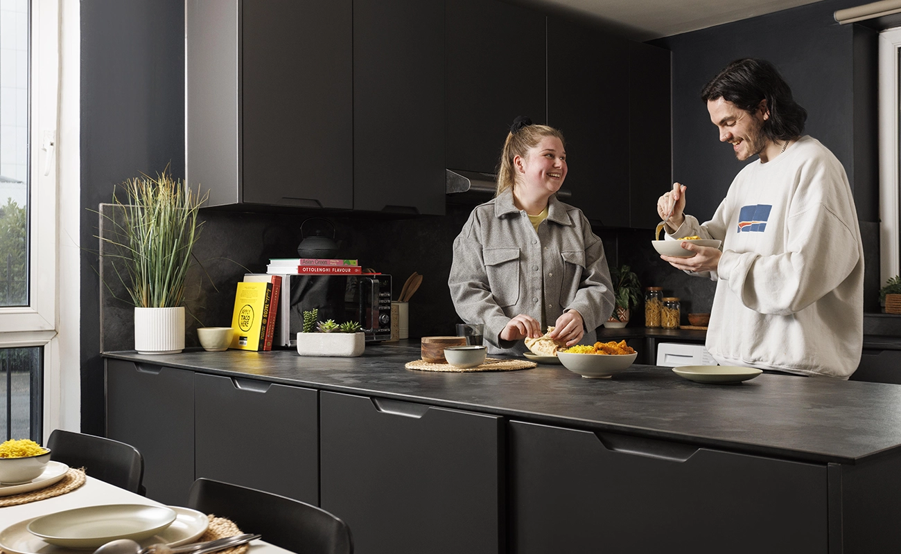 Students using the shared kitchen for ensuite rooms