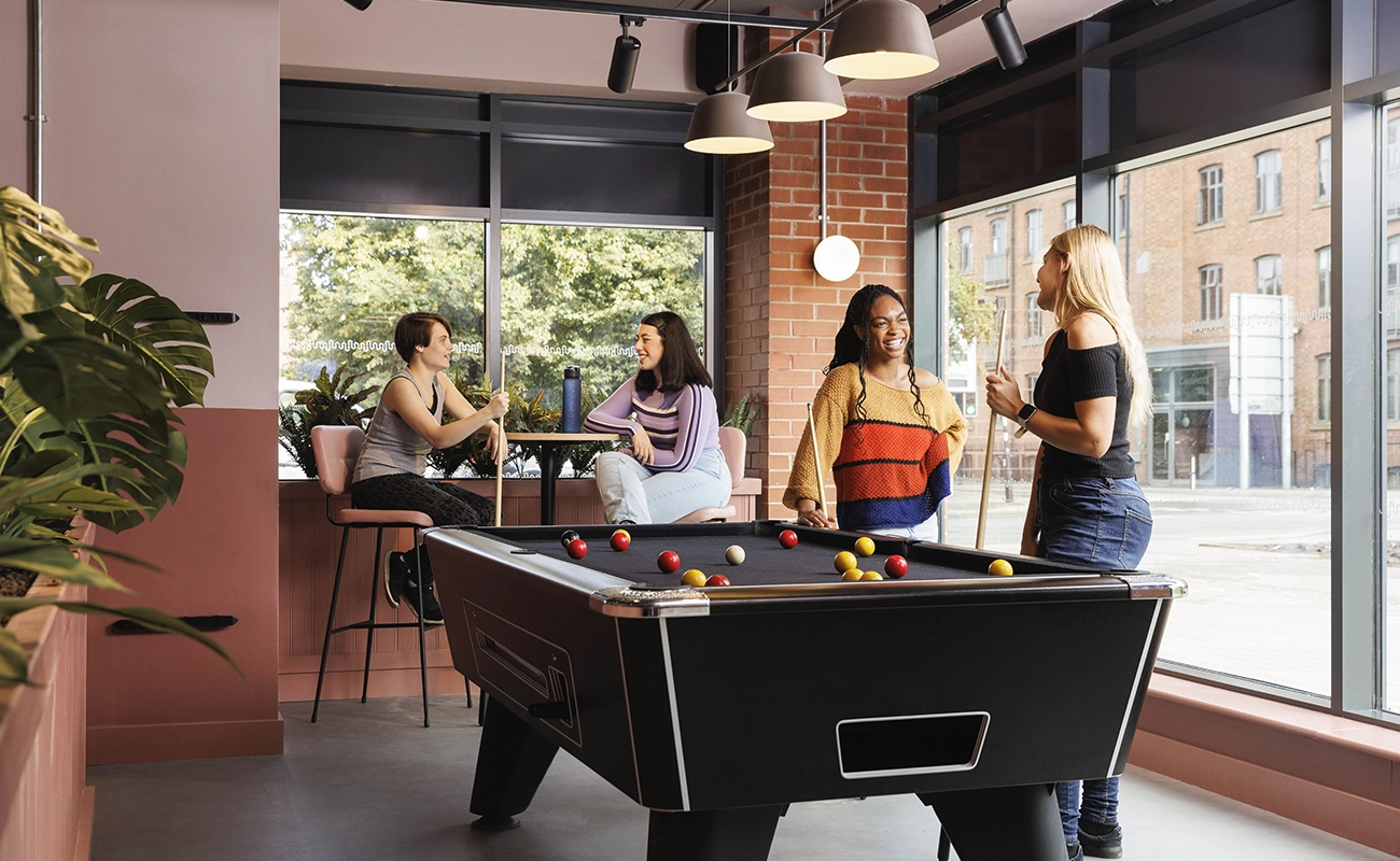 Students using the games area in the common room