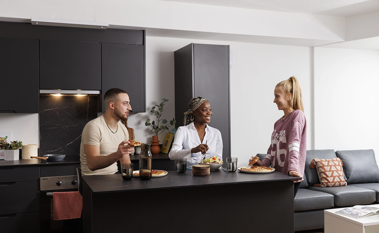 Students using the shared kitchen