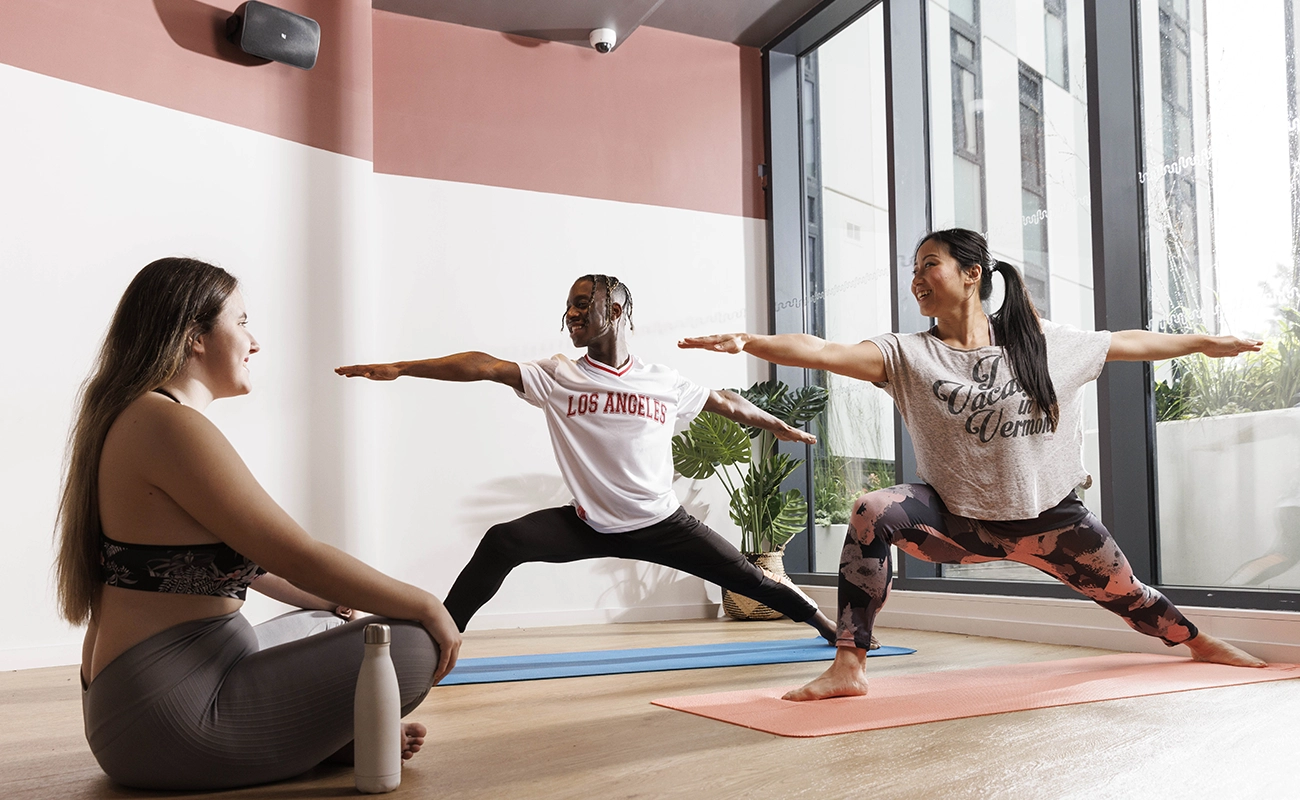 Students using the yoga room (also the cinema room)