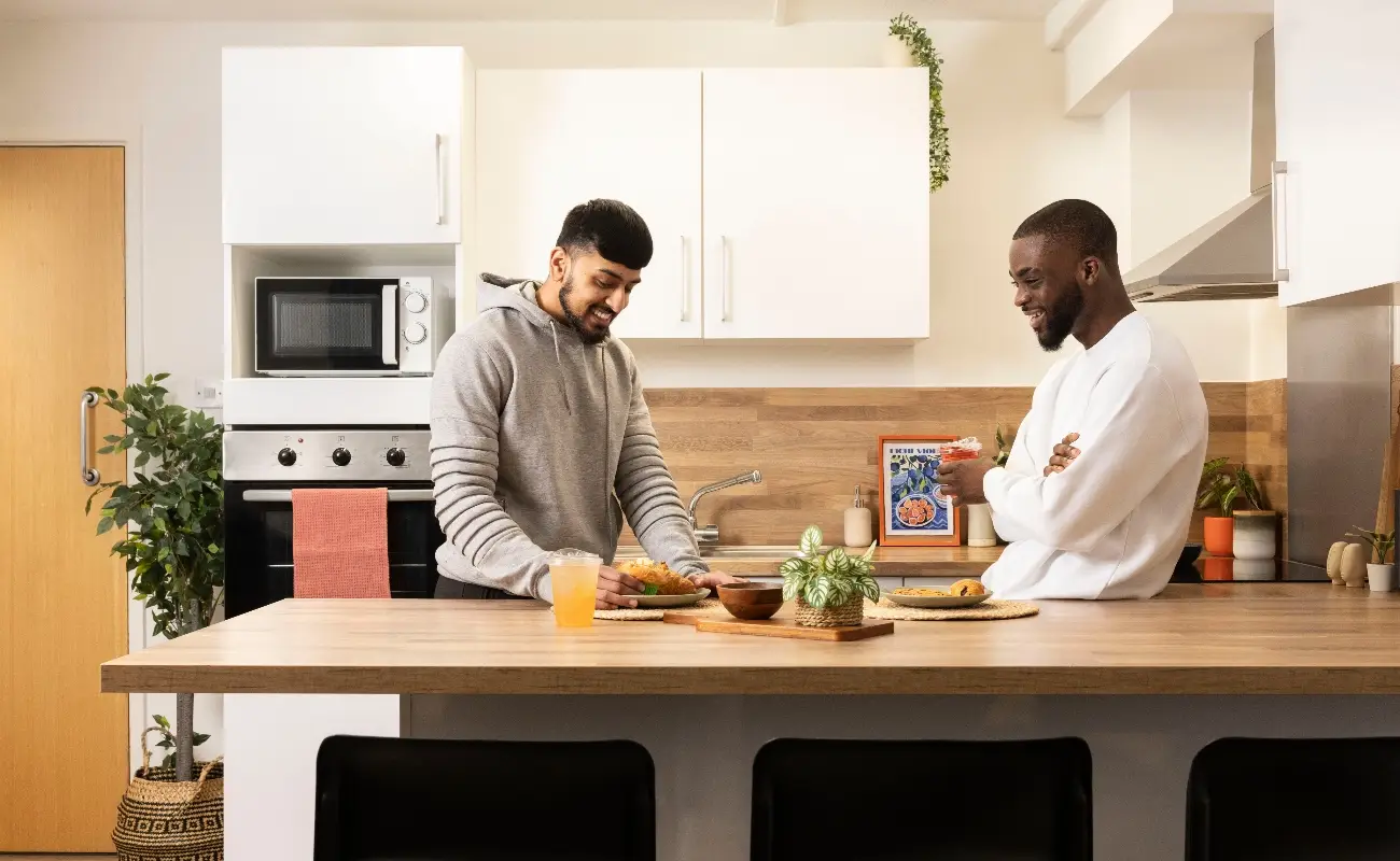 Students in a shared kitchen