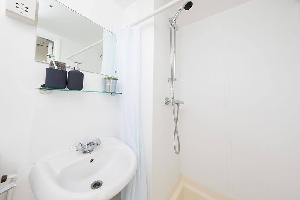 Sink and shower in a Classic Studio room