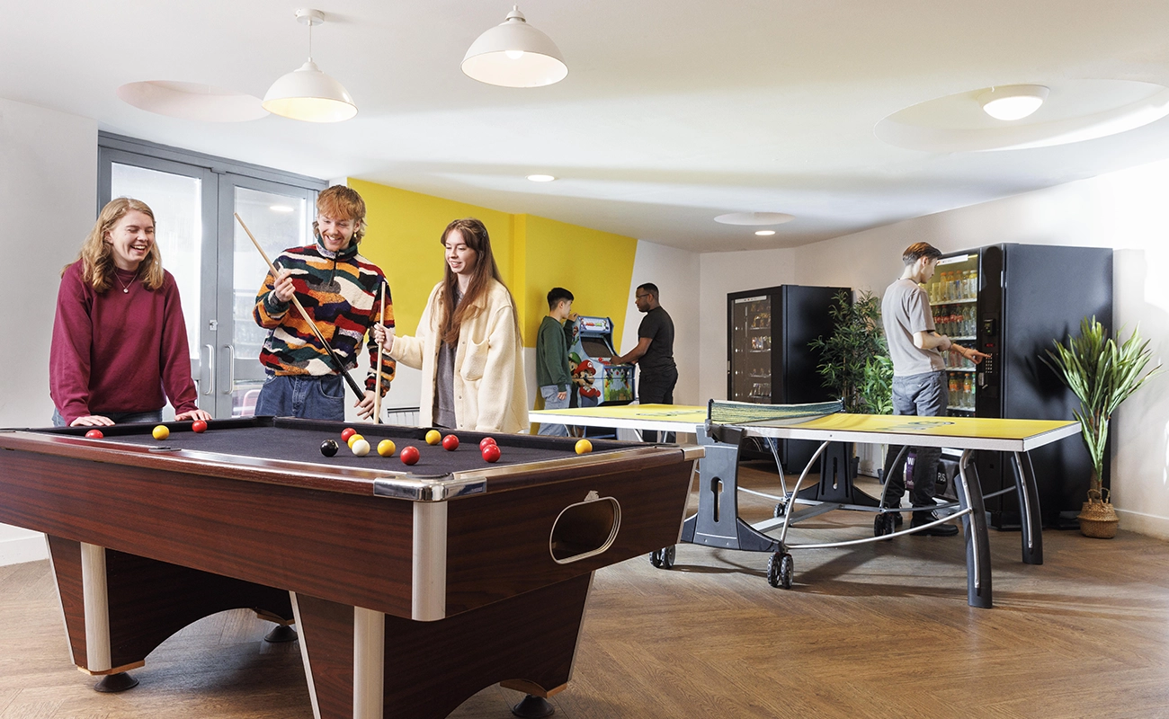 Students in the common room games area