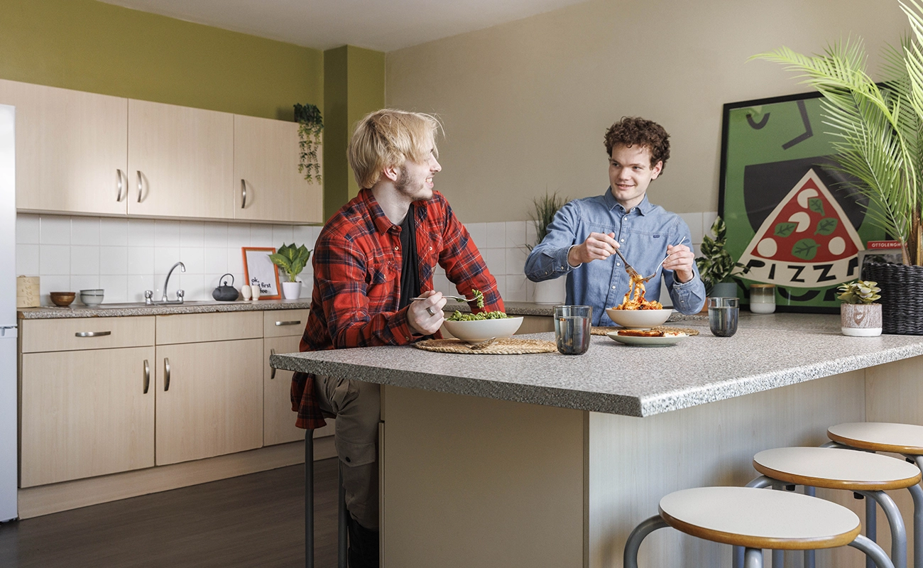 Students in the shared kitchen for ensuite rooms