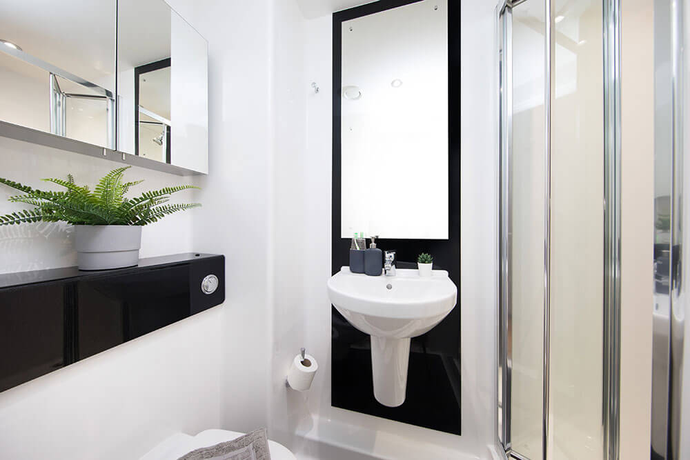 Sink, shower and toilet in bathroom at Unite Students Parade Green student accommodation