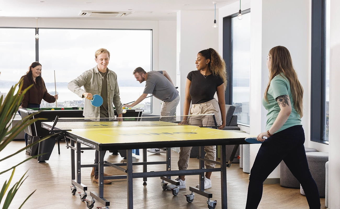 Students using the games area in the common room