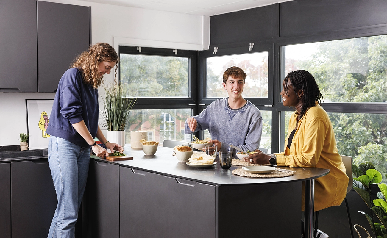 Students using the shared kitchen