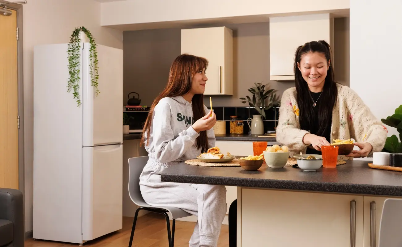 Students in a shared kitchen