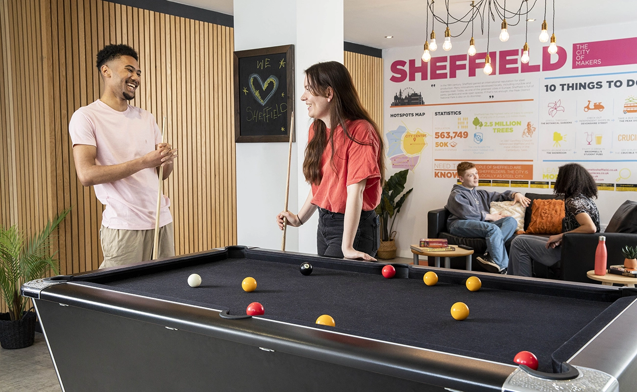 Students using the games area in the common room